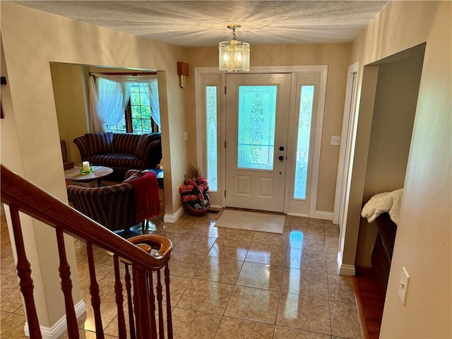 293 Sandy Hill Rd, Middlesex Twp, PA 16059 - foyer with a chandelier, light tile patterned floors, and a textured ceiling