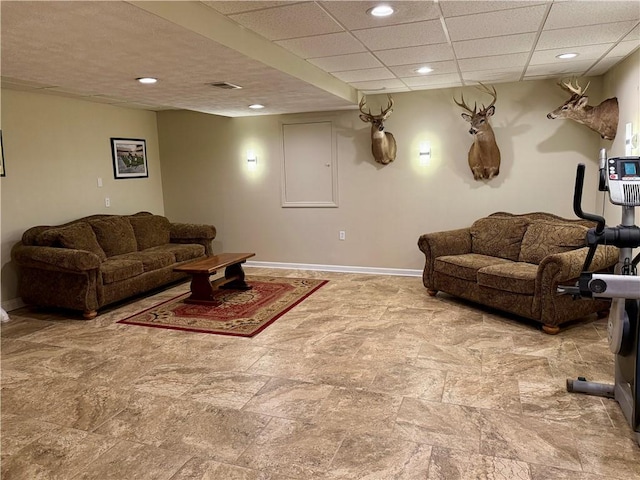 293 Sandy Hill Rd, Middlesex Twp, PA 16059 - living room featuring recessed lighting, stone finish flooring, and a drop ceiling