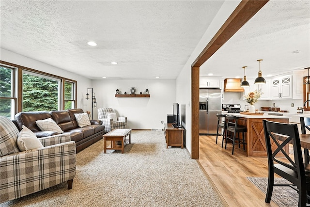 314 Shannon Cir, Daugherty Twp, PA 15066 - living room with a textured ceiling, recessed lighting, and light wood-style flooring