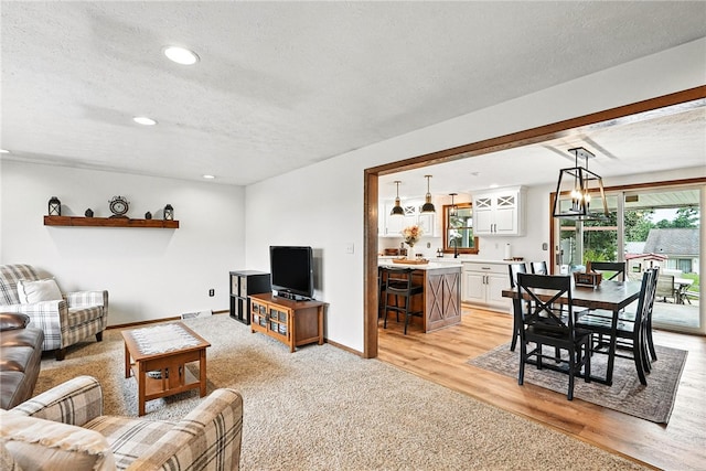 314 Shannon Cir, Daugherty Twp, PA 15066 - living room featuring a textured ceiling, light wood-type flooring, and recessed lighting