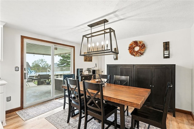 314 Shannon Cir, Daugherty Twp, PA 15066 - dining room with light wood-type flooring and baseboards