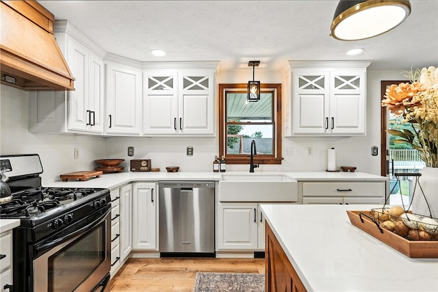 314 Shannon Cir, Daugherty Twp, PA 15066 - kitchen with appliances with stainless steel finishes, custom exhaust hood, light countertops, white cabinetry, and recessed lighting