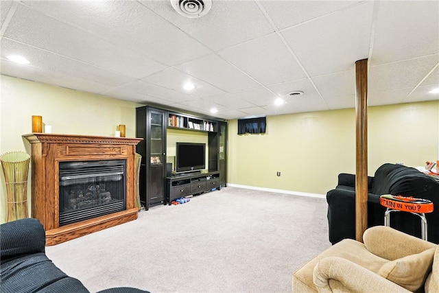 314 Shannon Cir, Daugherty Twp, PA 15066 - living room featuring carpet floors, recessed lighting, a drop ceiling, and a glass covered fireplace