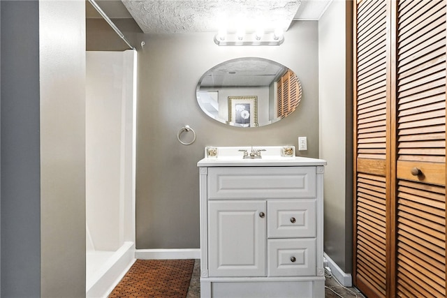 314 Shannon Cir, Daugherty Twp, PA 15066 - bathroom featuring a shower, vanity, a textured ceiling, and a closet