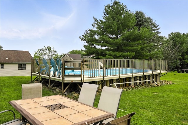 314 Shannon Cir, Daugherty Twp, PA 15066 - view of swimming pool with outdoor dining area, a wooden deck, and a lawn