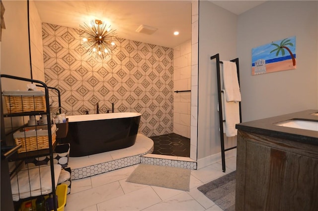 710 Cedar Ave, Central North Side, PA 15212 - full bath with a soaking tub, vanity, a chandelier, marble look tiles, and a walk in shower
