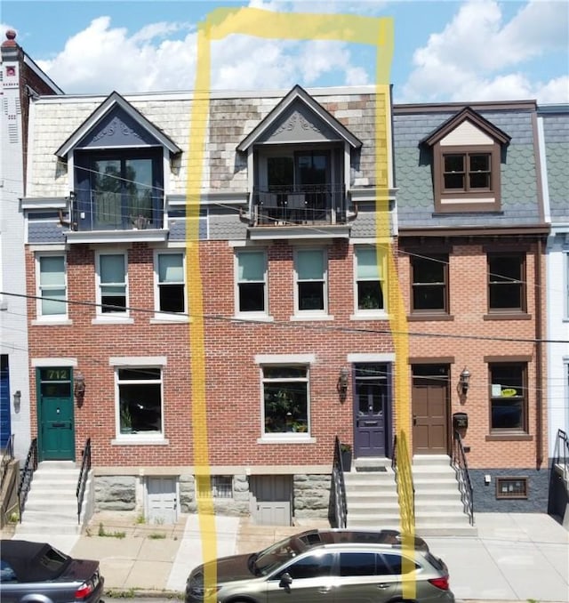 710 Cedar Ave, Central North Side, PA 15212 - view of front of property featuring entry steps, brick siding, and mansard roof