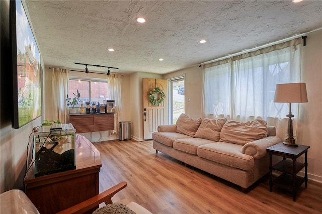 1023 Bellair Rd, Port Vue, PA 15133 - living area featuring light wood finished floors, recessed lighting, and a textured ceiling