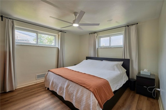 1023 Bellair Rd, Port Vue, PA 15133 - bedroom featuring multiple windows, wood finished floors, and ceiling fan