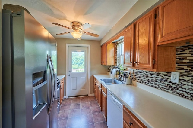 1023 Bellair Rd, Port Vue, PA 15133 - kitchen featuring stainless steel fridge with ice dispenser, dishwasher, brown cabinetry, light countertops, and backsplash