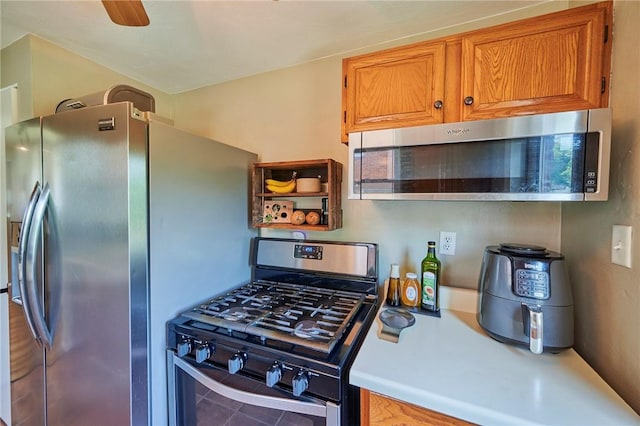 1023 Bellair Rd, Port Vue, PA 15133 - kitchen featuring appliances with stainless steel finishes, light countertops, brown cabinets, open shelves, and tile patterned floors