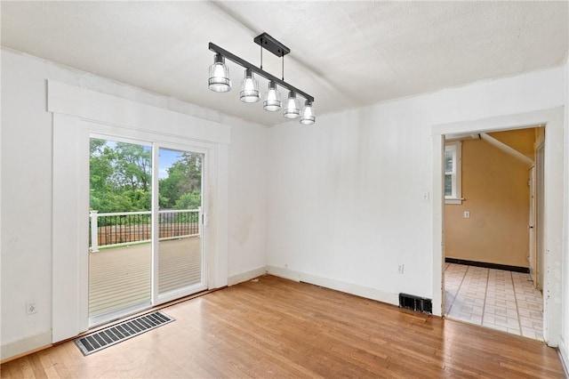 2600 Voelkel Ave, Beechview, PA 15216 - unfurnished dining area featuring wood finished floors and baseboards