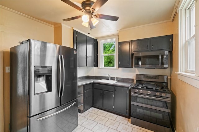 2600 Voelkel Ave, Beechview, PA 15216 - kitchen featuring stainless steel appliances, dark countertops, ceiling fan, crown molding, and brick patterned flooring