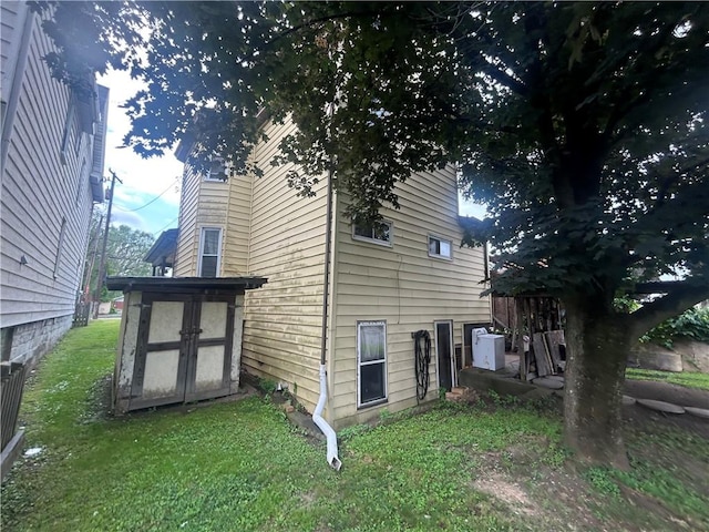 822 4th St, West Elizabeth, PA 15088 - view of property exterior with a storage unit and a lawn