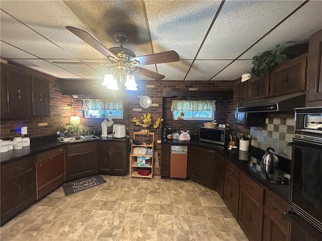 822 4th St, West Elizabeth, PA 15088 - kitchen featuring stainless steel microwave, a paneled ceiling, ceiling fan, black oven, and dark countertops