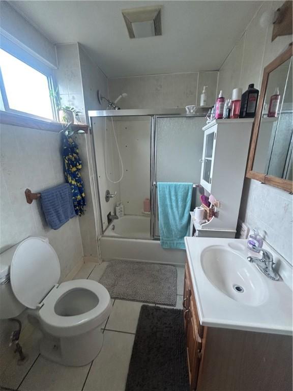 822 4th St, West Elizabeth, PA 15088 - bathroom with vanity, tile patterned flooring, and shower / bath combination with glass door