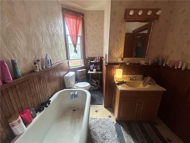 822 4th St, West Elizabeth, PA 15088 - full bath featuring wallpapered walls, a wainscoted wall, a tub, vanity, and tile patterned flooring