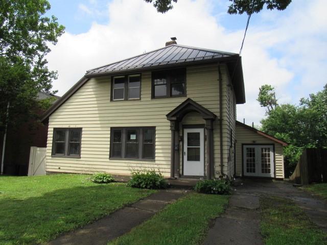 409 Keystone Dr, New Kensington, PA 15068 - view of front of house with a standing seam roof, french doors, a front lawn, and a metal roof