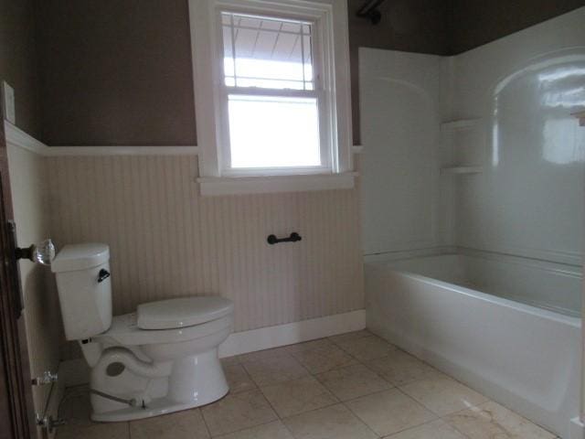 409 Keystone Dr, New Kensington, PA 15068 - full bathroom with a wainscoted wall, bathing tub / shower combination, and tile patterned floors