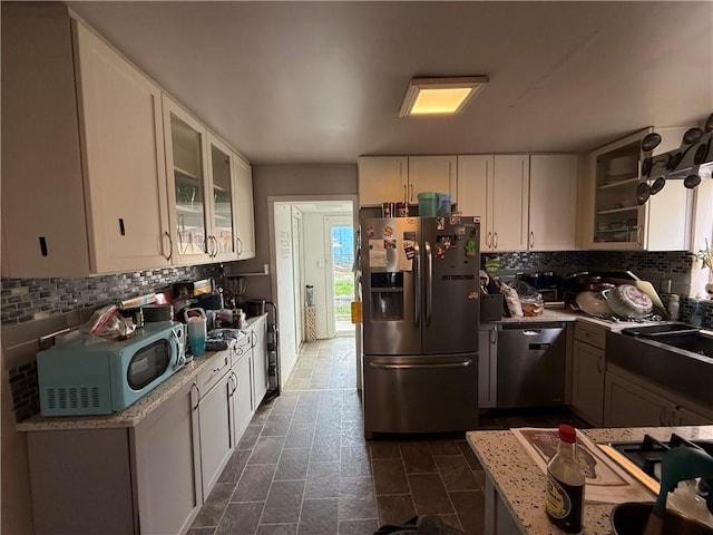 431 New York Ave, Rochester Twp, PA 15074 - kitchen featuring stainless steel appliances, white cabinetry, backsplash, glass insert cabinets, and light countertops