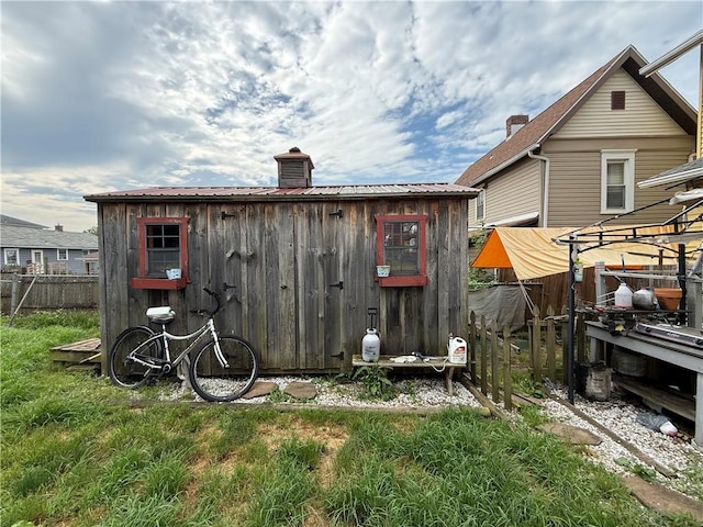 431 New York Ave, Rochester Twp, PA 15074 - back of house with a metal roof, an outdoor structure, and a chimney