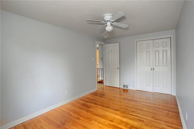 7034 Penn Ave, Point Breeze, PA 15208 - unfurnished bedroom featuring light wood finished floors, a closet, and a ceiling fan