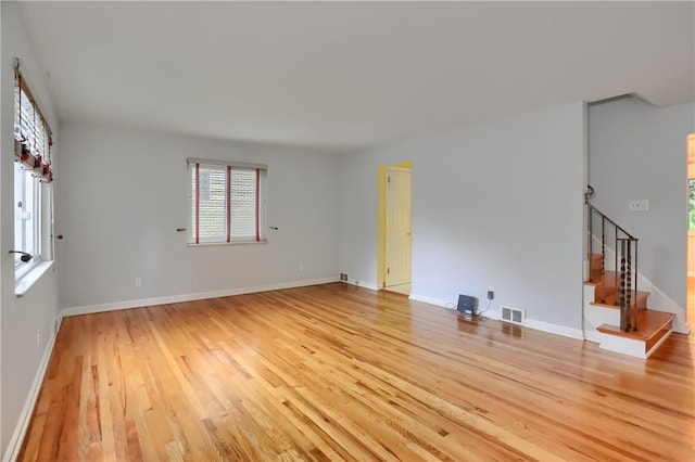 7034 Penn Ave, Point Breeze, PA 15208 - spare room with light wood-style floors and stairway
