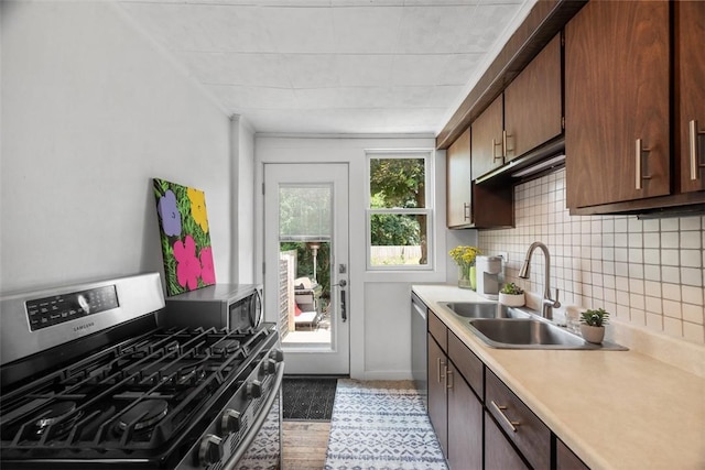1229 Richmond St, Regent Square, PA 15218 - kitchen featuring appliances with stainless steel finishes, light countertops, backsplash, and light wood-style flooring
