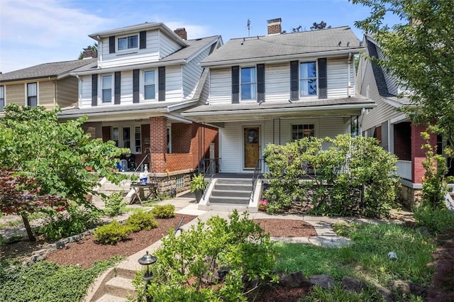 1229 Richmond St, Regent Square, PA 15218 - american foursquare style home with covered porch, a chimney, and brick siding