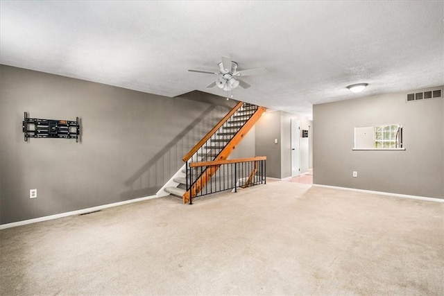 651 Newton Sq, Moon/Crescent Twp, PA 15108 - unfurnished living room featuring ceiling fan, stairway, carpet, and a textured ceiling