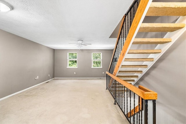 651 Newton Sq, Moon/Crescent Twp, PA 15108 - unfurnished living room featuring carpet, a ceiling fan, stairway, and a textured ceiling