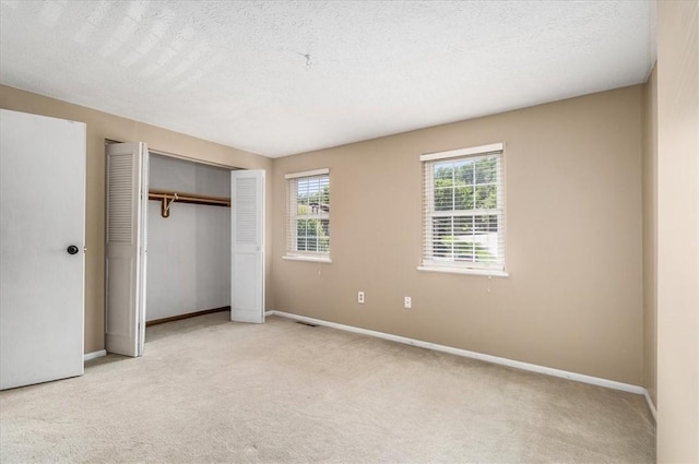 651 Newton Sq, Moon/Crescent Twp, PA 15108 - unfurnished bedroom with light carpet, a closet, and a textured ceiling