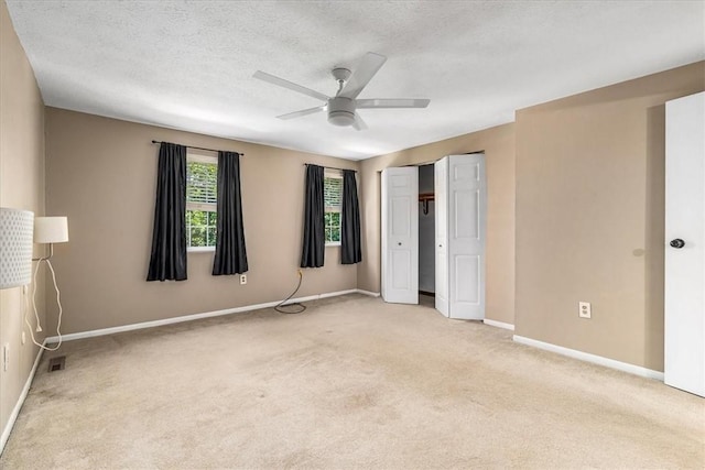 651 Newton Sq, Moon/Crescent Twp, PA 15108 - unfurnished bedroom featuring carpet floors, a ceiling fan, a closet, and a textured ceiling