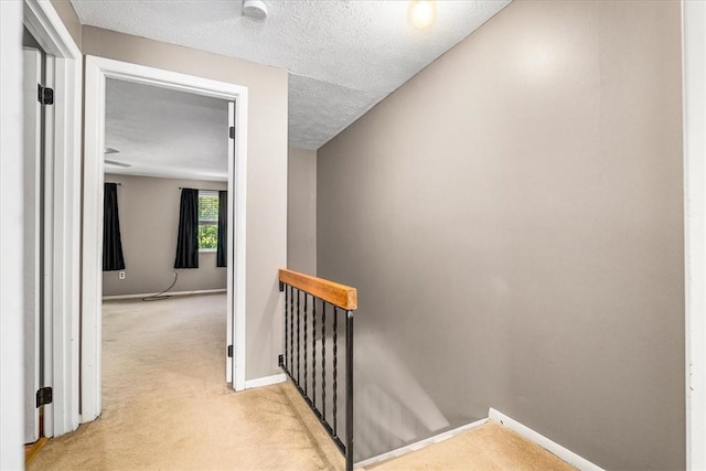 651 Newton Sq, Moon/Crescent Twp, PA 15108 - staircase with carpet floors and a textured ceiling