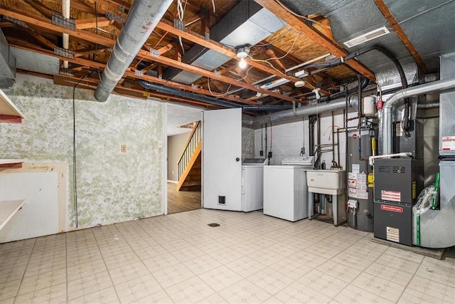 651 Newton Sq, Moon/Crescent Twp, PA 15108 - unfinished basement with washer and dryer, stairway, tile patterned floors, and water heater