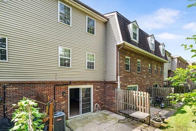 651 Newton Sq, Moon/Crescent Twp, PA 15108 - rear view of house with a patio area and brick siding