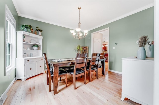 1044 Cross Creek Dr, South Union Twp, PA 15401 - dining room featuring a chandelier, light wood finished floors, healthy amount of natural light, and ornamental molding