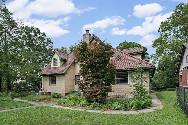 1302 Mount Royal Blvd, Shaler, PA 15223 - view of side of home with a tiled roof, a chimney, and brick siding