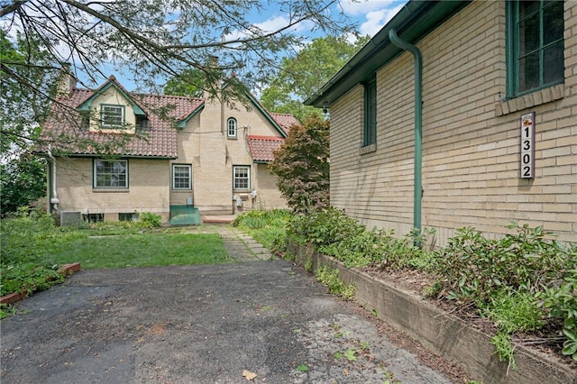 1302 Mount Royal Blvd, Shaler, PA 15223 - view of side of home featuring a chimney and brick siding