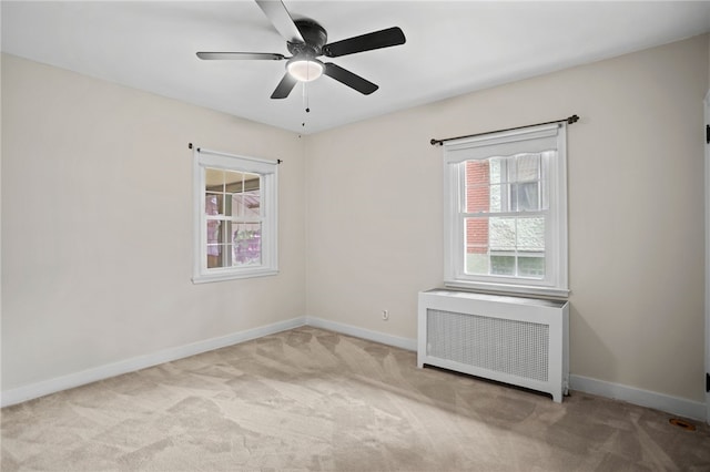 1302 Mount Royal Blvd, Shaler, PA 15223 - unfurnished room featuring radiator heating unit, carpet flooring, and a ceiling fan