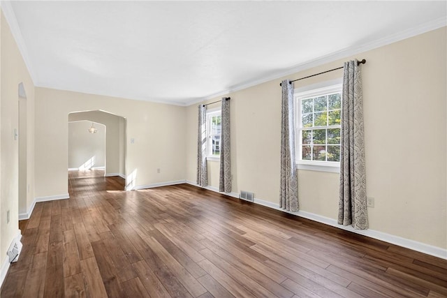 112 Oxford Pl, Saint Clair, PA 15241 - empty room featuring arched walkways, dark wood-type flooring, and crown molding
