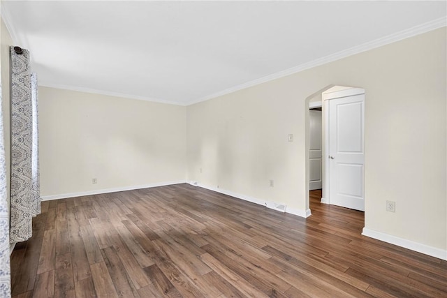 112 Oxford Pl, Saint Clair, PA 15241 - spare room featuring arched walkways, dark wood-type flooring, and ornamental molding