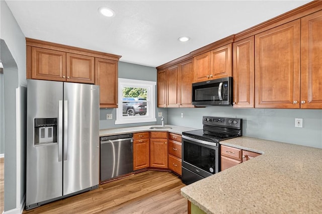 112 Oxford Pl, Saint Clair, PA 15241 - kitchen with appliances with stainless steel finishes, light wood-style floors, brown cabinetry, light countertops, and recessed lighting