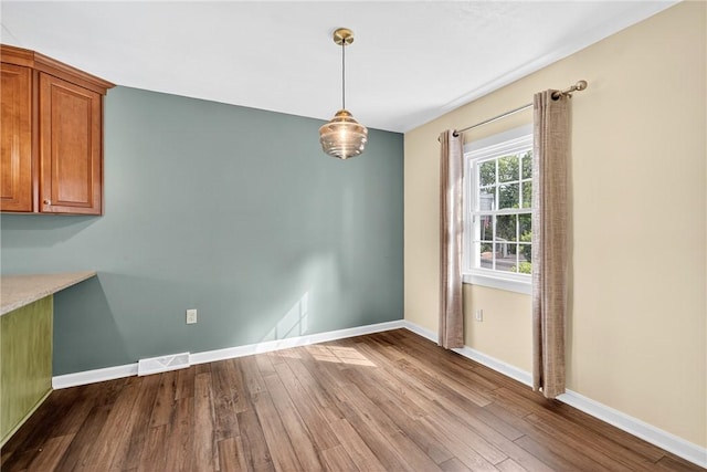 112 Oxford Pl, Saint Clair, PA 15241 - unfurnished dining area with dark wood-style floors