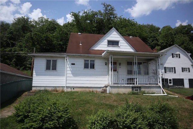 721 Spring St, Roscoe, PA 15477 - rear view of property with covered porch and a lawn