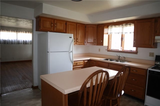 721 Spring St, Roscoe, PA 15477 - kitchen featuring white appliances, brown cabinetry, light countertops, and healthy amount of natural light