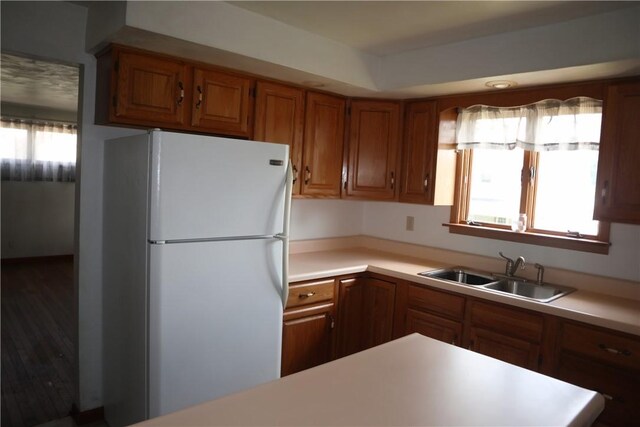 721 Spring St, Roscoe, PA 15477 - kitchen featuring freestanding refrigerator, brown cabinets, and light countertops