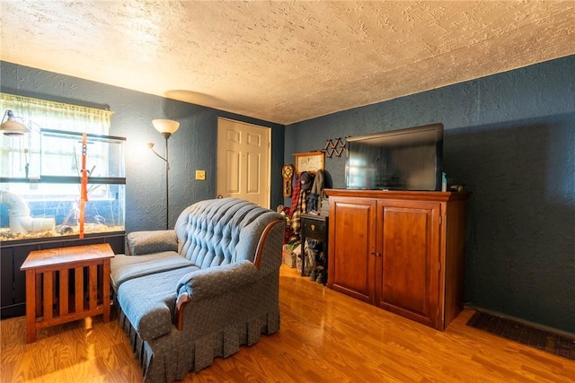309 Francis Ave, Monongahela, PA 15063 - sitting room featuring a textured wall, wood finished floors, and a textured ceiling