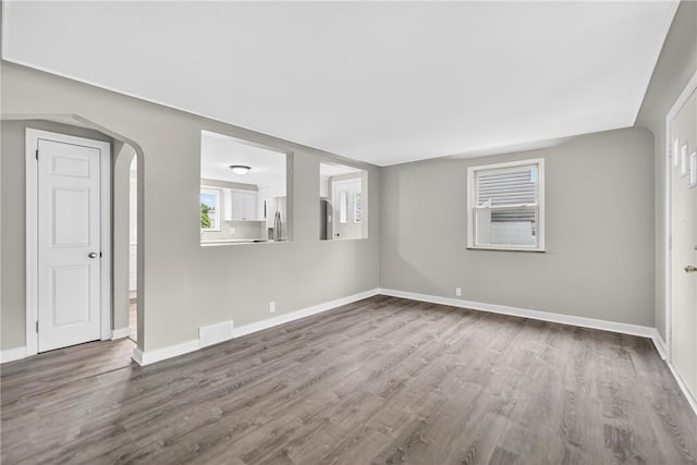 88 Pennsylvania Blvd, Monessen, PA 15062 - spare room featuring wood finished floors and arched walkways