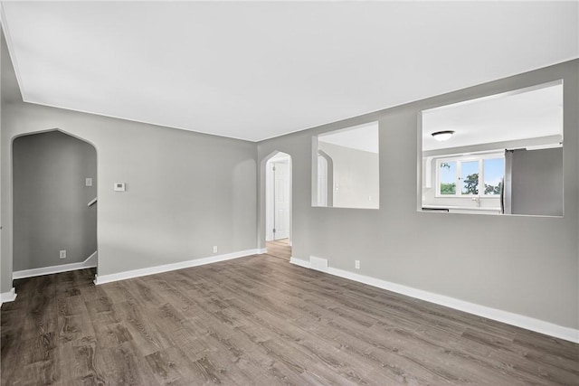 88 Pennsylvania Blvd, Monessen, PA 15062 - unfurnished room with arched walkways and wood finished floors